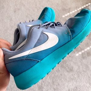 Purple and teal Nike Roshes